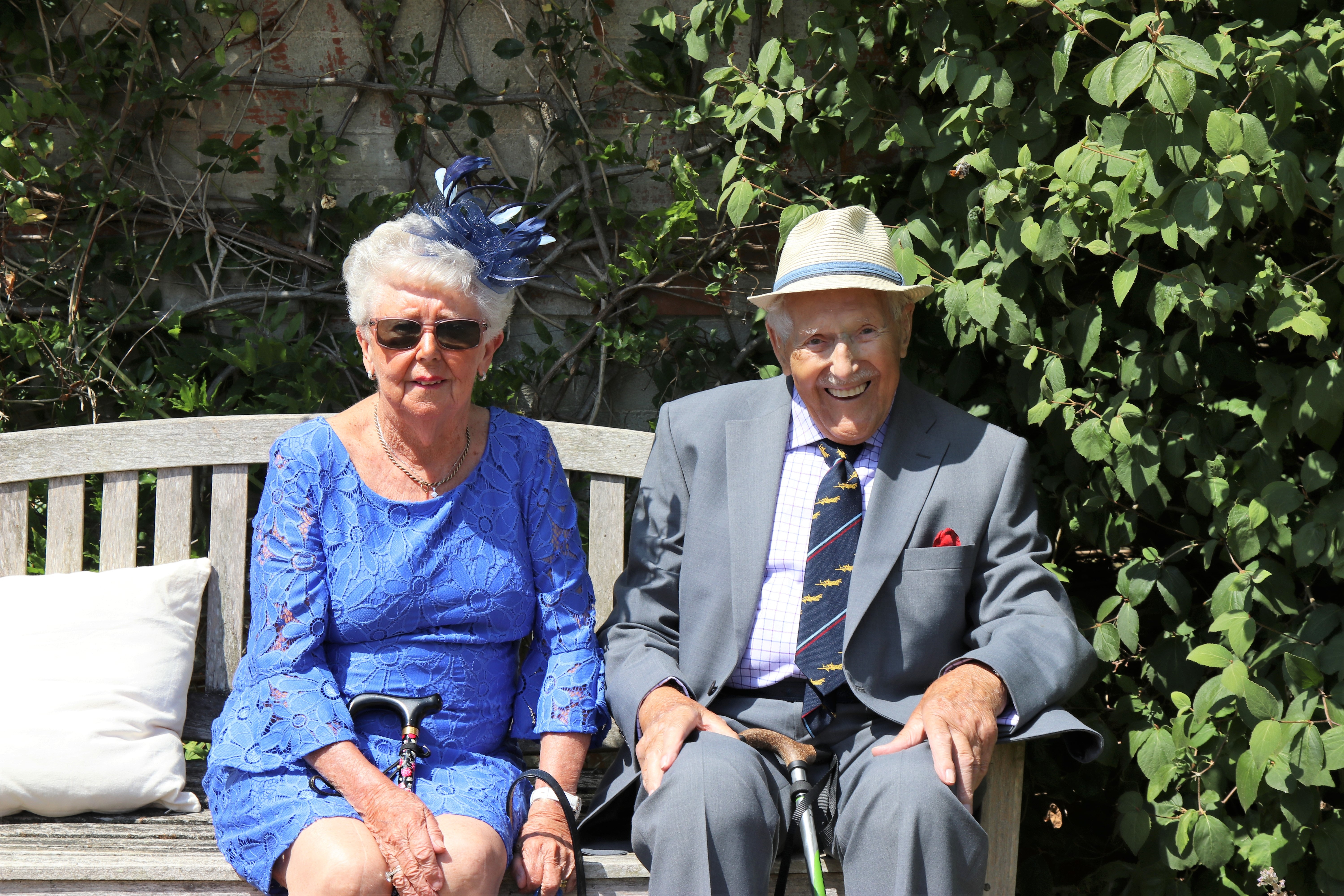 older couple sitting on a bench